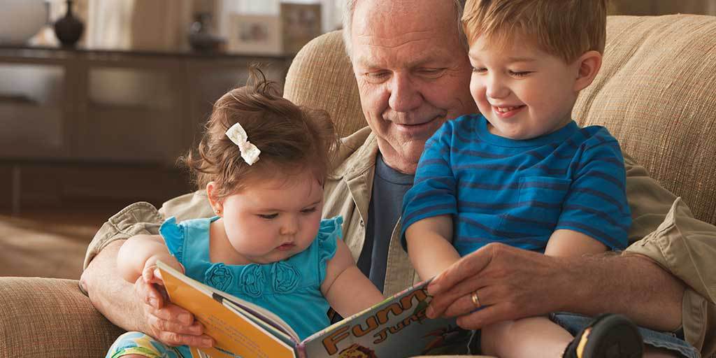 Robert reading stories to his grandchildren